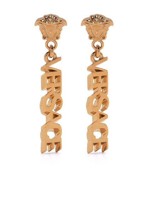 aretes versace de oro